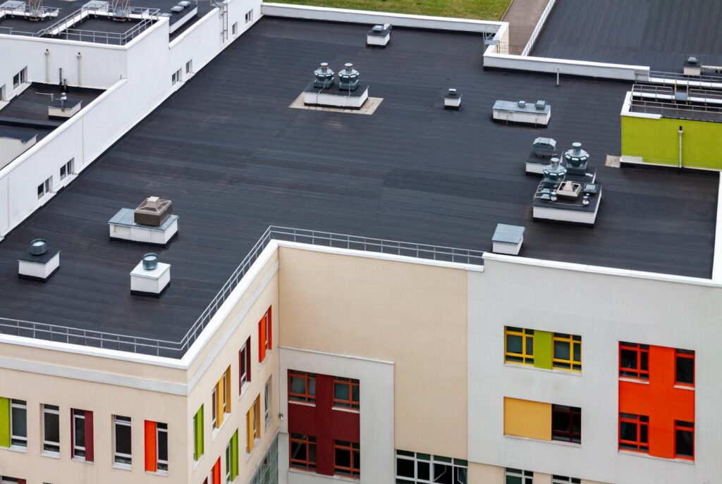 Top view flat roof with air conditioners and hydro insulation membranes on top of a modern apartment yellow green red building. SSUCv3H4sIAAAAAAAACoRTy27cIBTdV+o/jFh3VAPGNlm2q0iR+gFRF9jQMRoMIx6pqmj+vYAHF08TZQfnHs4998Hr50+HAxiZkxN4OLymW7xLpYLzlnlpdISbLzfcCs2FrZEXi7umBgSX3ljJVA2OzE+zZouIoA5KJfiag8B55oMTrsrOrWCL8zLTcdFg3IzCeTOda3SUp4xdZuNNHeDiYpz0GU/isATcHLwXdlOqvEzMi1M0v3NTevO83g8lkIPxRQyBb0EqLvXJfX1imi/Mnh245VtzhjHRfgTPjbGgRNa072g+ap5mkDr5htR3o2MwTHlCm956+Lm17CT09CfVcq2qtEIJtnb8eaWC8+/YkSVXfSOxwKWpuvBiJqbcXb8uVk6x6uqZ8XPej/JsMkF7myyAUgVQxlzYqNJwf0VNUfCZORfpvOD1YGInzFLl0cbnAm6qgMfJpSvEqEN06LseE0gooh2o12yWUSfbKQbDRRnGRUq6zWC/gLCDA4EIIbqNYb+LhYC7f4T7tSycthL5b0NXDq45d8taKD1dGWWB0lYsMjL3dbzjYmg+KGWg8CMLtCk/7e1+4R4Vj7vPHkUk332vO4+ghX3T0wH328LsLIIWxWhLhmGL3zkEkJKONGTAcKPsHAIUPfa0I33+OTdvMvUODP3ACWXNUSBCji1pm+PA4hW3HFIMaYMgiq+ufwEAAP//AwBJlIeUOAUAAA==
